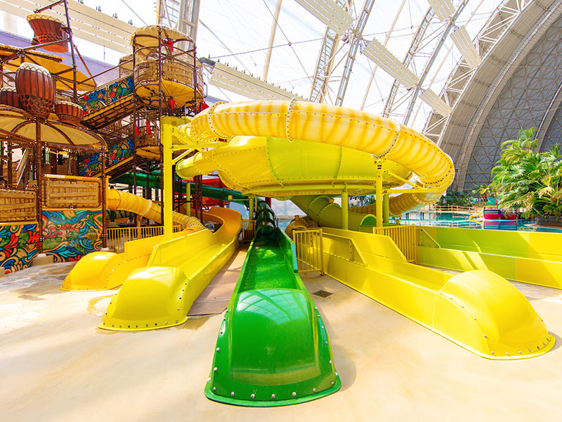 The Jungle Splash children’s slide tower seen from a frog’s-eye view, with the South Seas in the background.