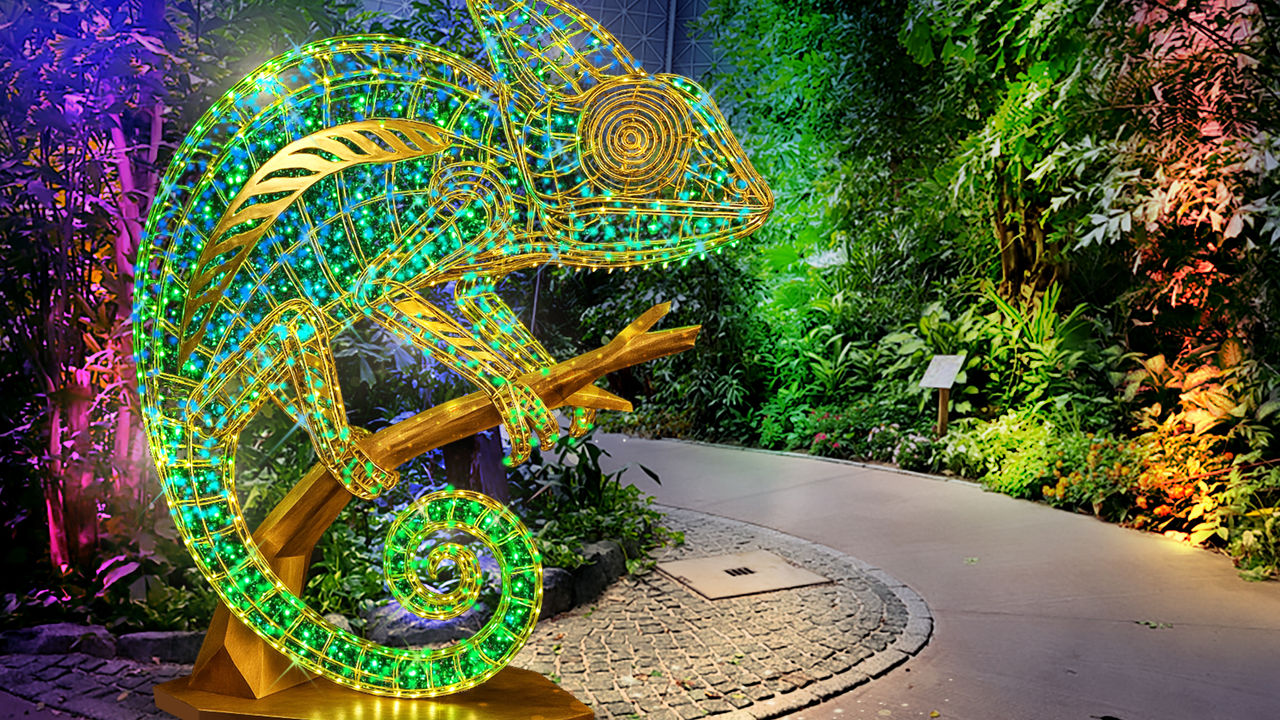 Glowing chameleon sitting on a branch.