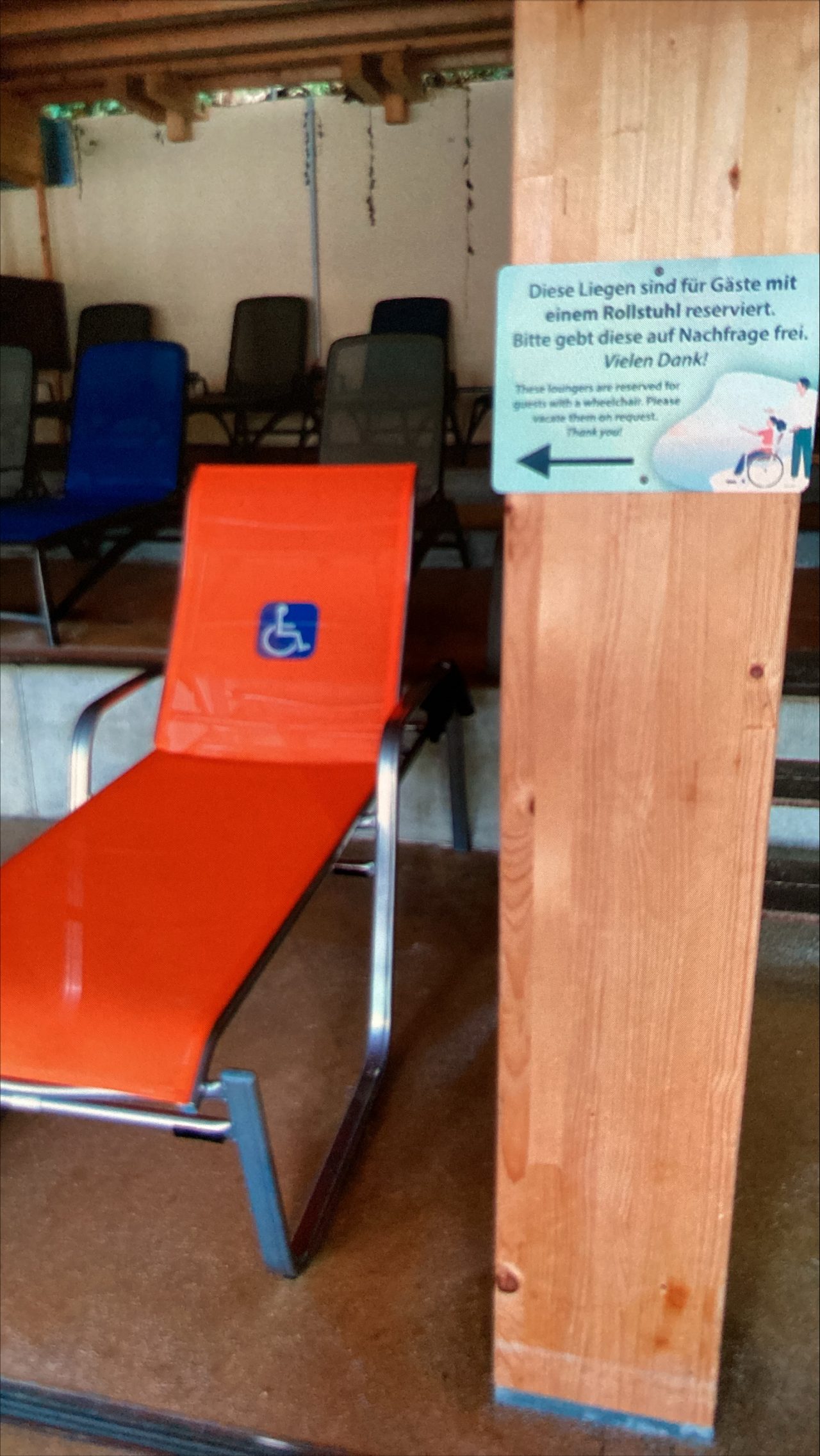 Raised orange loungers with a blue wheelchair symbol
